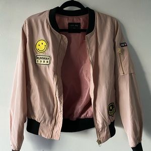 Used pink bomber jacket with patches